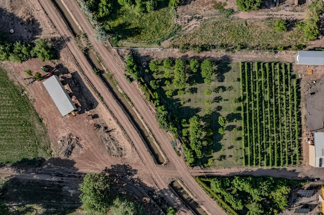 birds eye view of property featuring a rural view