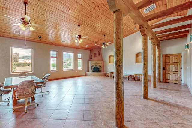 interior space featuring a fireplace, beamed ceiling, wood ceiling, and light tile patterned floors