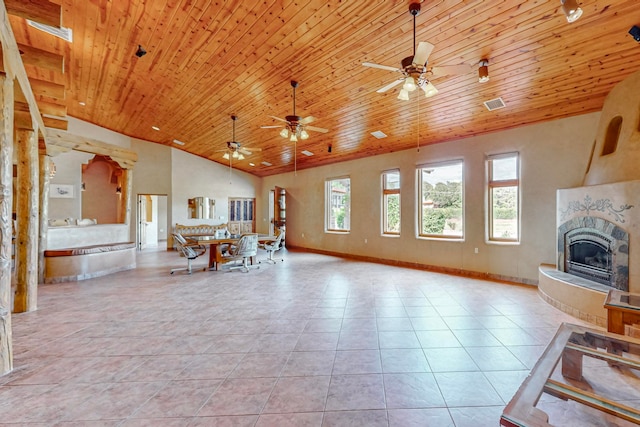 unfurnished living room featuring light tile patterned floors, high vaulted ceiling, a large fireplace, wooden ceiling, and ceiling fan