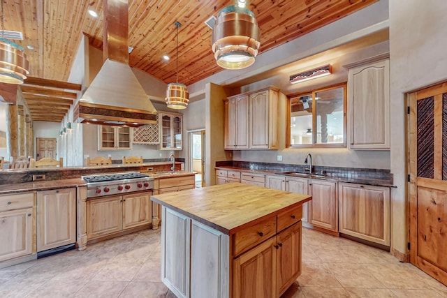 kitchen featuring butcher block counters, wooden ceiling, light brown cabinets, and premium range hood