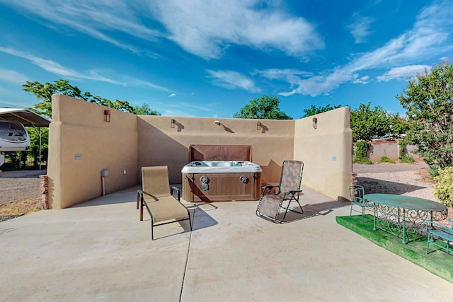 view of patio with a hot tub and grilling area