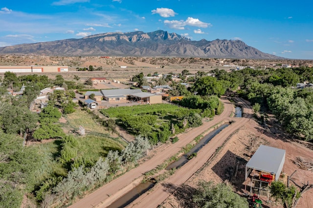 birds eye view of property with a mountain view