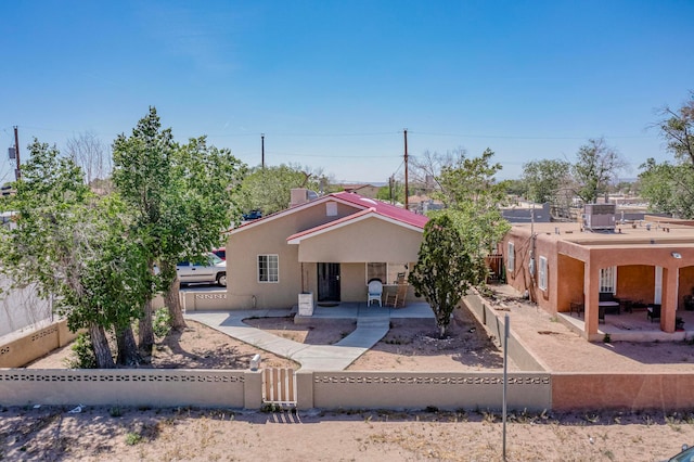 rear view of house with a patio