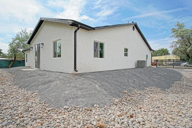 view of side of property featuring central AC unit