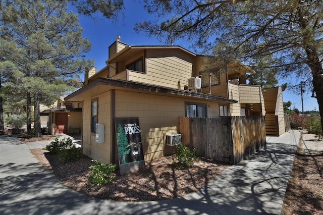 view of side of home featuring central air condition unit