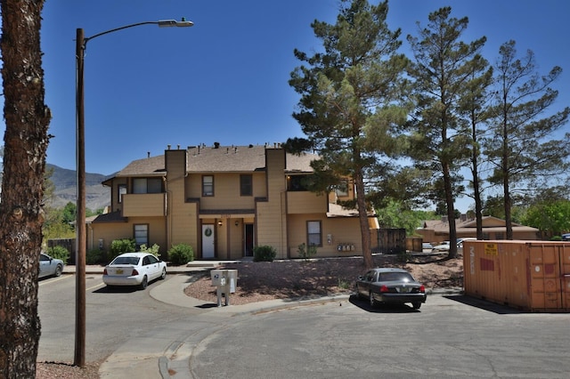 view of front of property with a mountain view