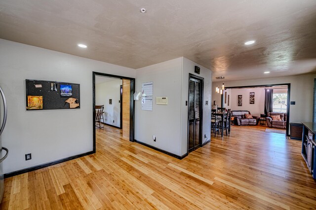 interior space featuring a chandelier and light wood-type flooring