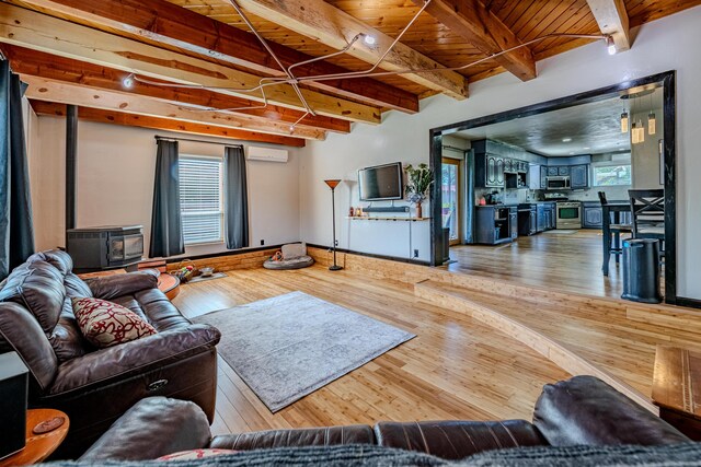 living room with a wall unit AC, beamed ceiling, wood ceiling, and wood-type flooring