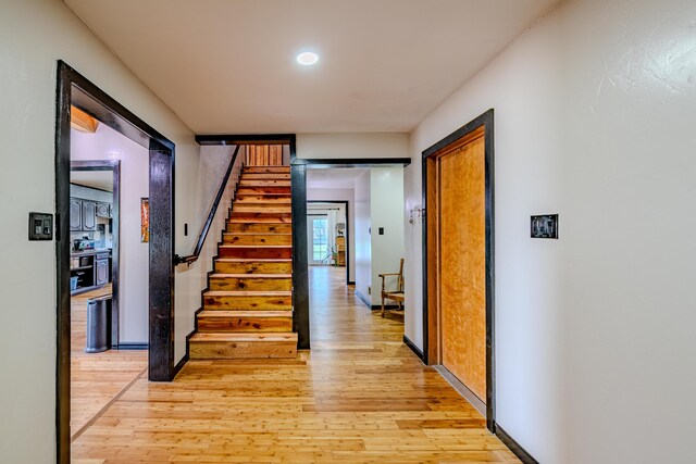 hall with light hardwood / wood-style floors