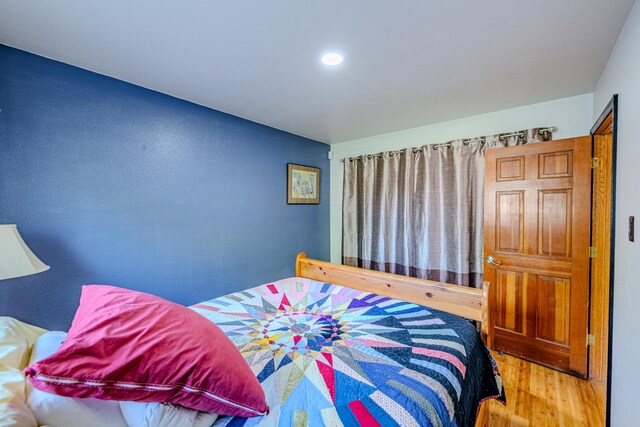 bedroom featuring hardwood / wood-style floors