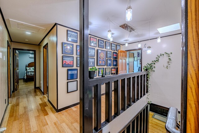 corridor with light hardwood / wood-style floors