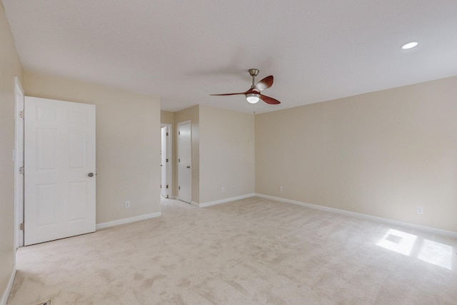 carpeted empty room with ceiling fan