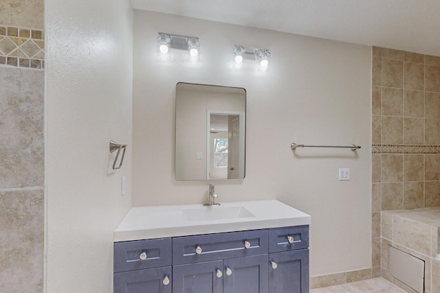 bathroom featuring tile patterned flooring and vanity