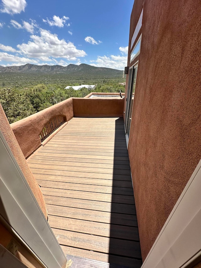 wooden terrace with a mountain view