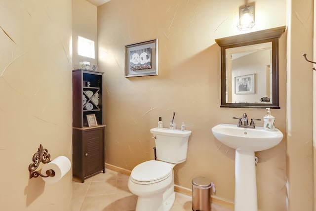 bathroom featuring tile patterned flooring and toilet