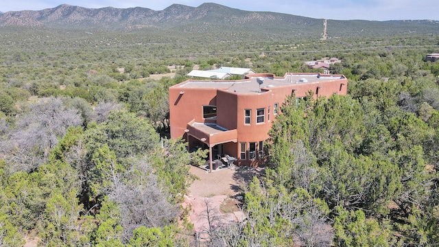 birds eye view of property with a mountain view