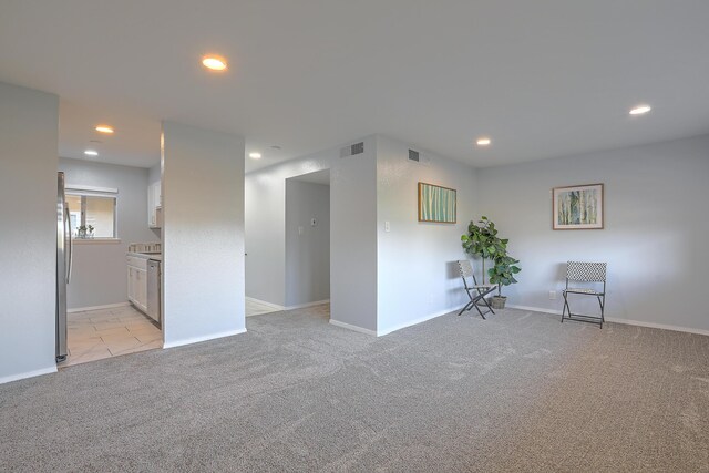 empty room featuring light colored carpet