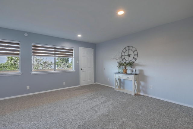 spare room featuring carpet floors