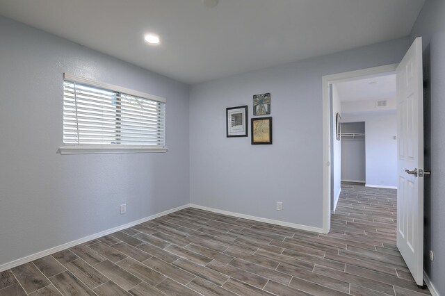 unfurnished room featuring wood-type flooring