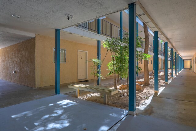 view of patio featuring a balcony