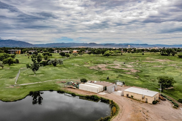 drone / aerial view featuring a rural view and a water and mountain view