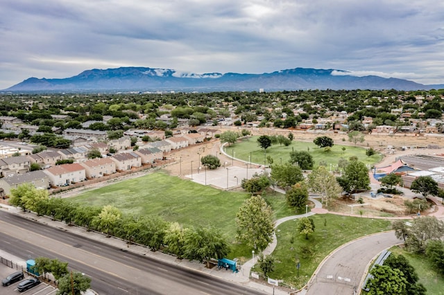 birds eye view of property with a mountain view