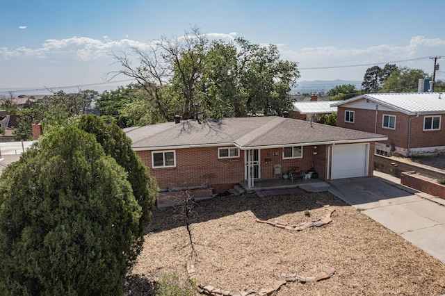 single story home featuring a garage