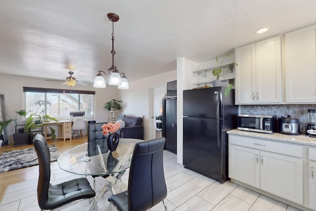 dining space featuring ceiling fan