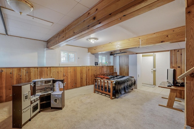 carpeted bedroom with wood walls