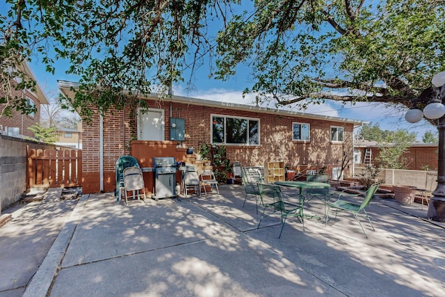 back of property featuring a patio area