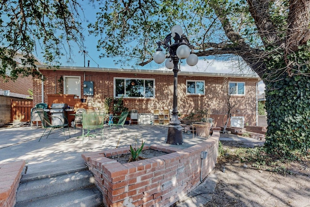 rear view of house featuring a patio