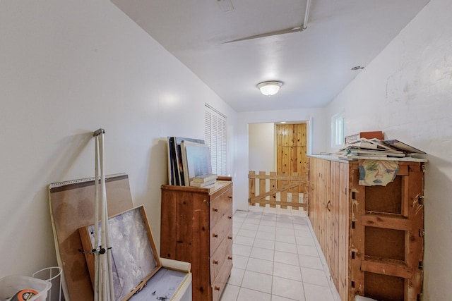 hall with light tile patterned floors