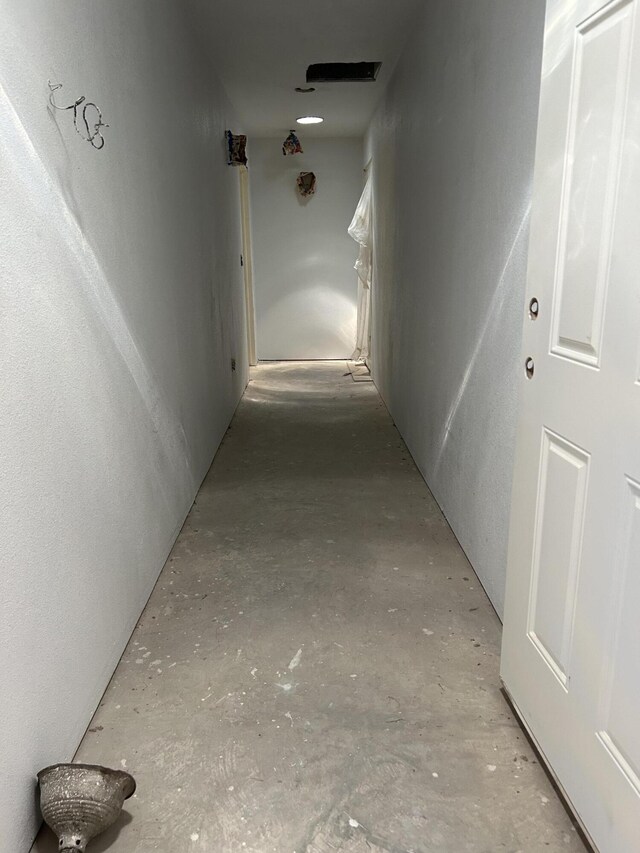 corridor with concrete floors