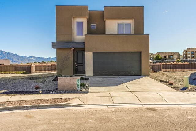 view of front of property featuring a mountain view and a garage