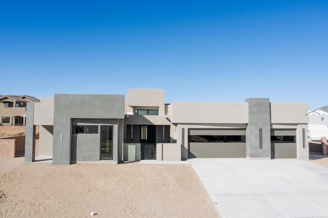 pueblo-style house with a garage