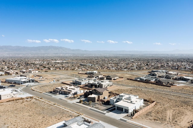 birds eye view of property with a mountain view