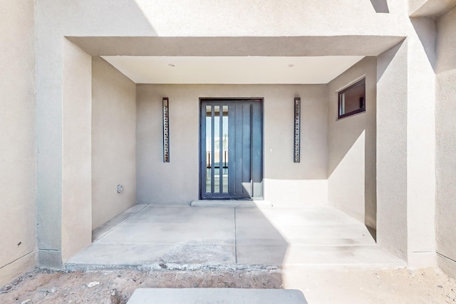 property entrance with a patio