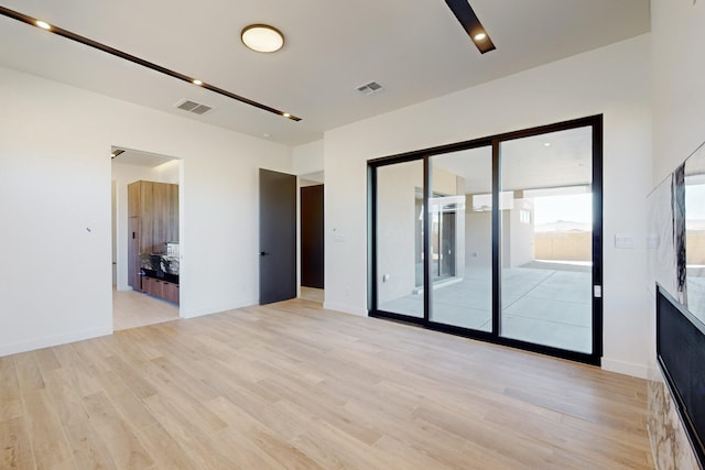 empty room with light wood-type flooring