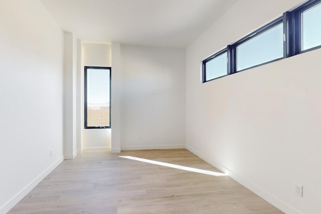 unfurnished room featuring light hardwood / wood-style floors