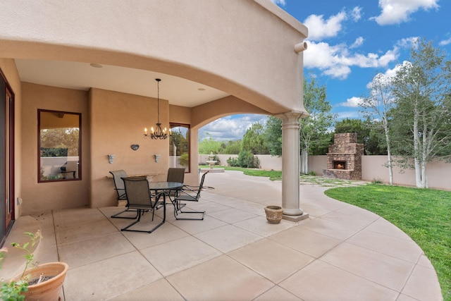 view of patio / terrace with an outdoor stone fireplace