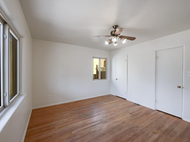 unfurnished bedroom featuring light hardwood / wood-style floors and ceiling fan