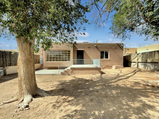 back of property featuring a patio