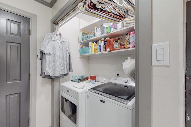 washroom featuring washing machine and dryer