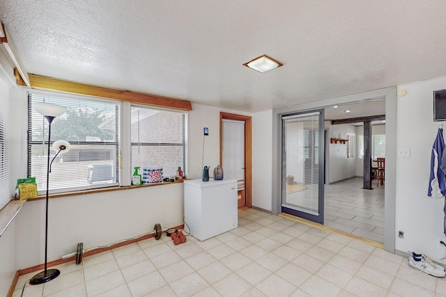 interior space featuring a textured ceiling