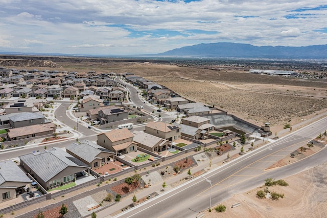 birds eye view of property with a mountain view