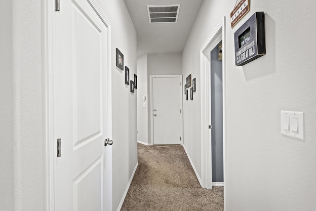 corridor featuring carpet flooring