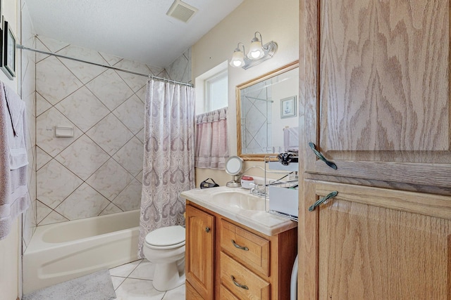 full bathroom featuring tile patterned flooring, vanity, toilet, and shower / bath combo with shower curtain