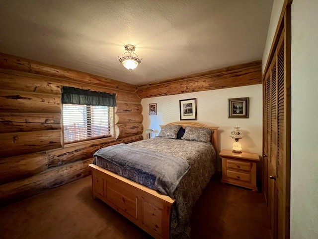 bedroom with dark carpet and a closet