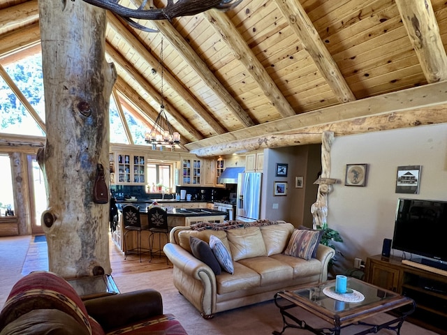 living area with a notable chandelier, light wood-style floors, high vaulted ceiling, wooden ceiling, and beamed ceiling