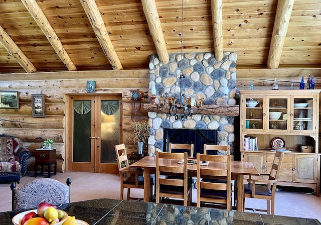 dining space with carpet floors, wood ceiling, rustic walls, and lofted ceiling with beams